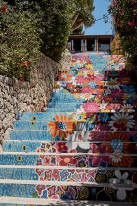 a set of stairs with flowers painted on them at Bikini Island & Mountain Port de Soller "Adults only" in Port de Soller