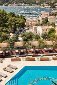 a resort with a pool and a view of a harbor at Bikini Island & Mountain Port de Soller "Adults only" in Port de Soller