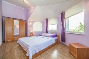Posteľ alebo postele v izbe v ubytovaní Apartments Đurđa