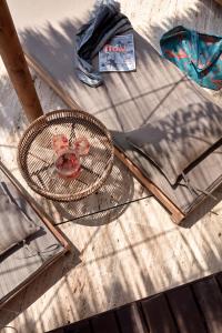 a wicker table with a racket on top of it at Bikini Island & Mountain Port de Soller "Adults only" in Port de Soller