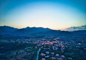 an aerial view of a city with mountains at Hotel San Teodoro in San Teodoro
