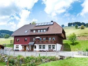 a house with solar panels on the roof at Haus Keller Ferienwohnungen in Todtnauberg