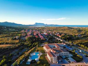an aerial view of a town with the ocean at Hotel San Teodoro in San Teodoro