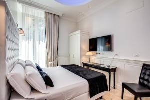 TV a/nebo společenská místnost v ubytování Hotel dei Quiriti Suite