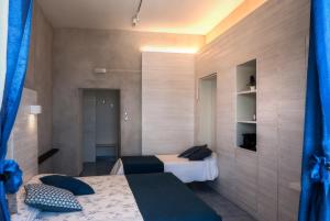 a bedroom with a bed and a window at La Sciabica in Agropoli