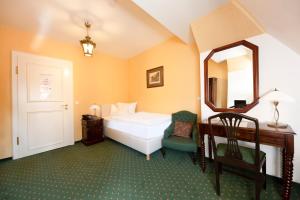
Ein Bett oder Betten in einem Zimmer der Unterkunft Ringhotel Villa Westerberge

