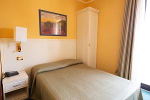 Postel nebo postele na pokoji v ubytování Cervara Park Hotel