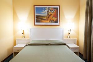 Postel nebo postele na pokoji v ubytování Cervara Park Hotel
