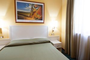 Postel nebo postele na pokoji v ubytování Cervara Park Hotel
