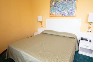 Postel nebo postele na pokoji v ubytování Cervara Park Hotel