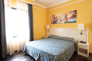 Postel nebo postele na pokoji v ubytování Cervara Park Hotel