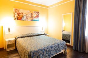 Postel nebo postele na pokoji v ubytování Cervara Park Hotel