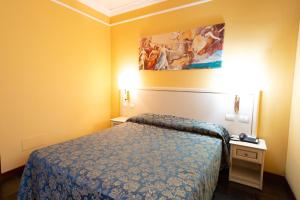 Postel nebo postele na pokoji v ubytování Cervara Park Hotel