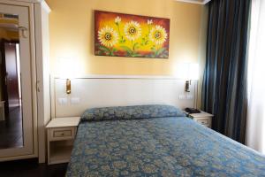 Postel nebo postele na pokoji v ubytování Cervara Park Hotel