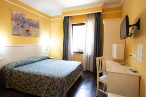Postel nebo postele na pokoji v ubytování Cervara Park Hotel