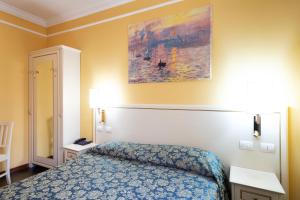 Postel nebo postele na pokoji v ubytování Cervara Park Hotel