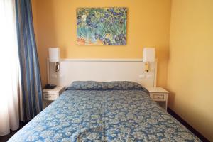 Postel nebo postele na pokoji v ubytování Cervara Park Hotel