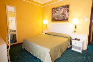 Postel nebo postele na pokoji v ubytování Cervara Park Hotel