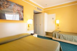 Postel nebo postele na pokoji v ubytování Cervara Park Hotel