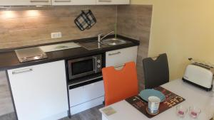 Kuchyň nebo kuchyňský kout v ubytování Ferienwohnung "Schonzeit"