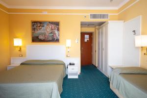 Postel nebo postele na pokoji v ubytování Cervara Park Hotel