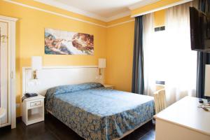 Postel nebo postele na pokoji v ubytování Cervara Park Hotel