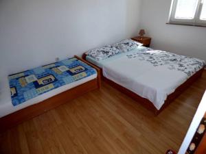 Ein Bett oder Betten in einem Zimmer der Unterkunft Apartments Branko Nin