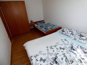 Ein Bett oder Betten in einem Zimmer der Unterkunft Apartments Branko Nin