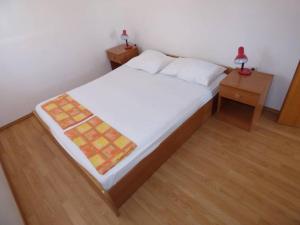 Ein Bett oder Betten in einem Zimmer der Unterkunft Apartments Branko Nin