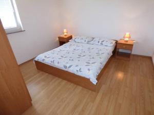 Ein Bett oder Betten in einem Zimmer der Unterkunft Apartments Branko Nin