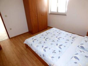 Ein Bett oder Betten in einem Zimmer der Unterkunft Apartments Branko Nin