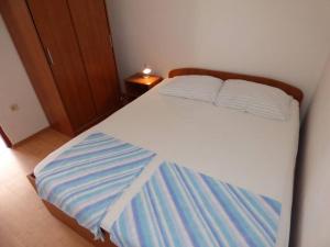Ein Bett oder Betten in einem Zimmer der Unterkunft Apartments Branko Nin