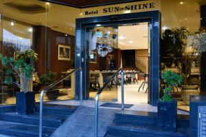 a store front of a store with a revolving door at Sun-Shine Hotel in San Clemente del Tuyú