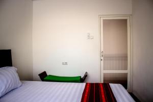 Postel nebo postele na pokoji v ubytování Donata House