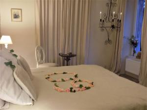 Postel nebo postele na pokoji v ubytování B&B Les Tilleuls