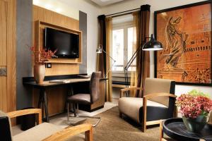 Televizorius ir (arba) pramogų centras apgyvendinimo įstaigoje Babuino 181 - Small Luxury Hotels of the World