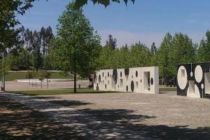 a sculpture in a park with trees in the background at Apartamento Rua da Amizade in Felgueiras
