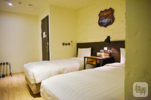Postel nebo postele na pokoji v ubytování Re-Change Hotel Taipei