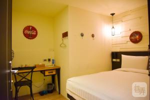 Postel nebo postele na pokoji v ubytování Re-Change Hotel Taipei