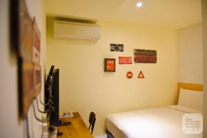 Postel nebo postele na pokoji v ubytování Re-Change Hotel Taipei