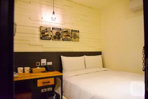 Postel nebo postele na pokoji v ubytování Re-Change Hotel Taipei