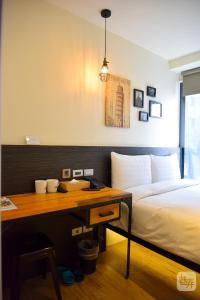 Postel nebo postele na pokoji v ubytování Re-Change Hotel Taipei