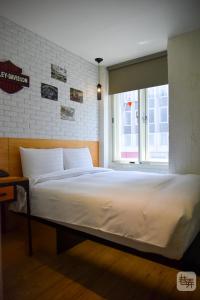 Postel nebo postele na pokoji v ubytování Re-Change Hotel Taipei