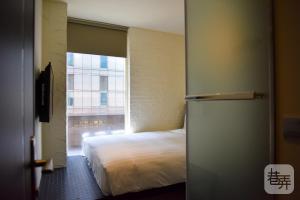 Postel nebo postele na pokoji v ubytování Re-Change Hotel Taipei