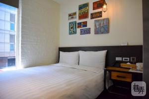 Postel nebo postele na pokoji v ubytování Re-Change Hotel Taipei + 37 fotografií