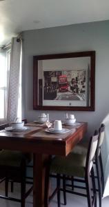 a dining room table with a picture of a cat on it at DB Tower Vacation Rental in Belize City