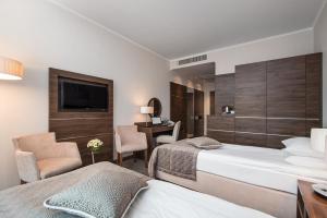 Postel nebo postele na pokoji v ubytování Hotel Różany Gaj - Destigo Hotels