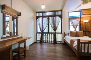 Кровать или кровати в номере Pak Chiang Mai