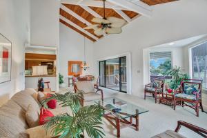 a living room with a couch and a table at CASTLE Kanaloa at Kona in Kailua-Kona