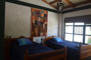 A bed or beds in a room at Hacienda Gonzabal